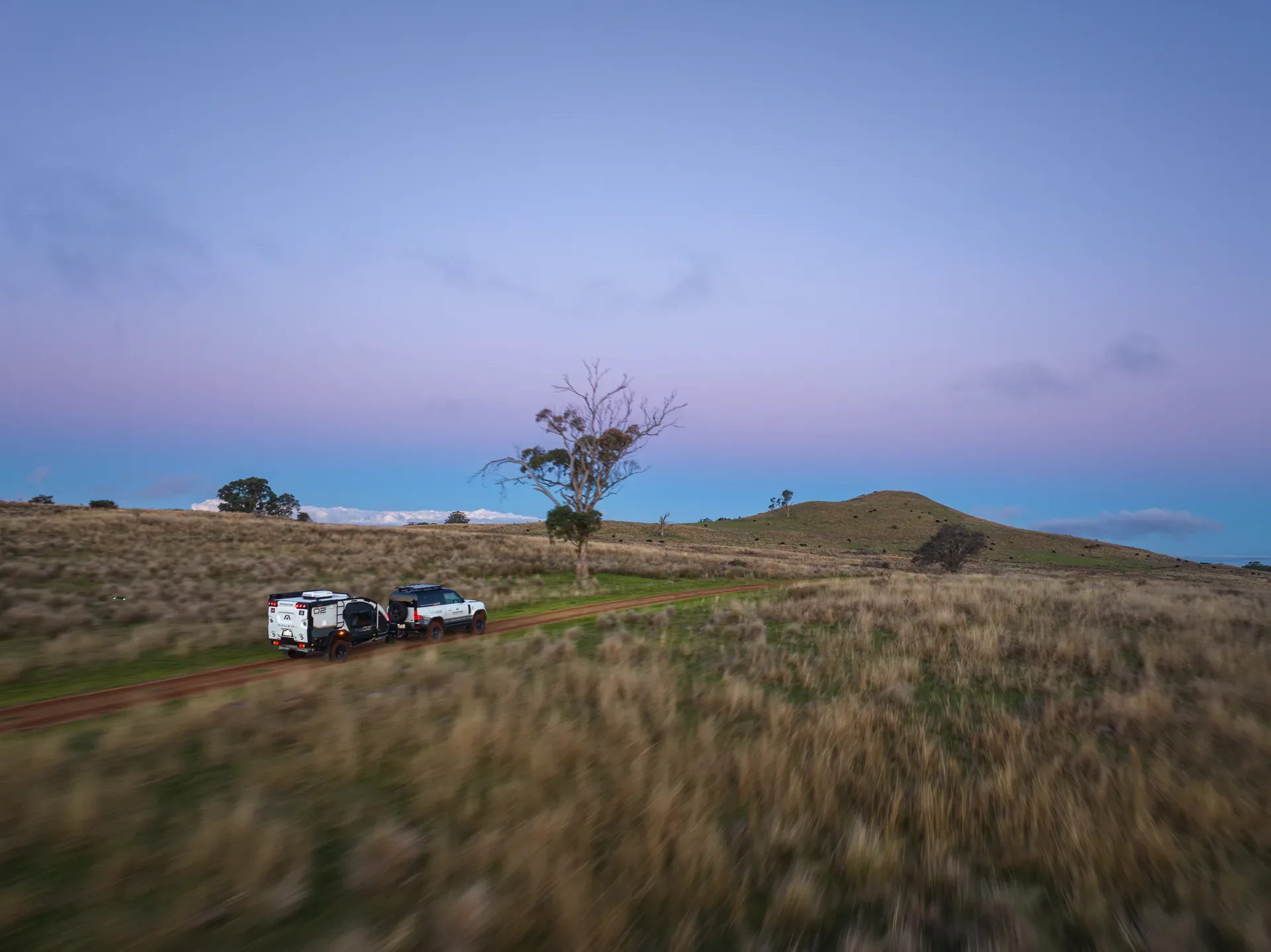 Rover Dusk Dirt Road Tow
