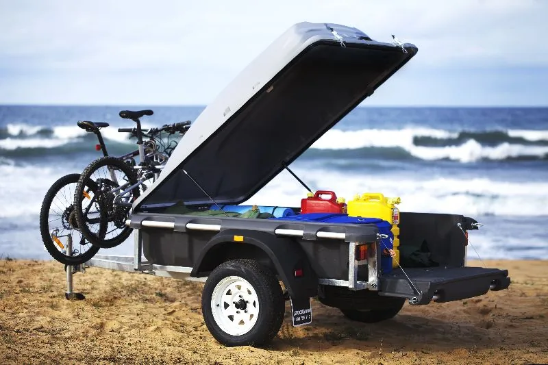 Pod Trailer with the lid and tailgate open near the coast