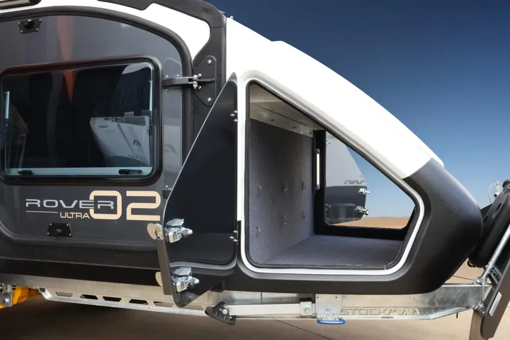 Rover dust-proof external storage box open behind the cabin