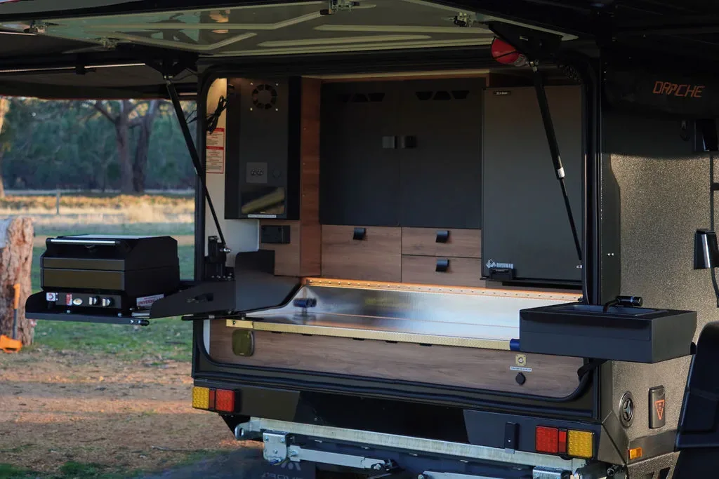 Rover Ultra kitchen with stainless sink, bench, fridge and storage drawers