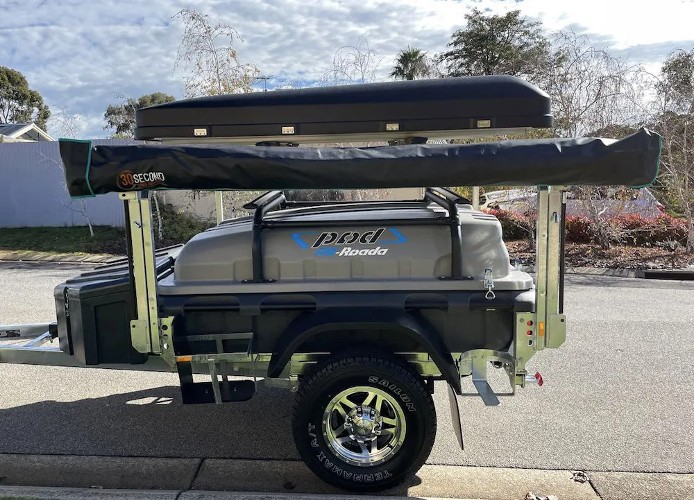 Pod Trailer with the lid and tailgate open near the coast