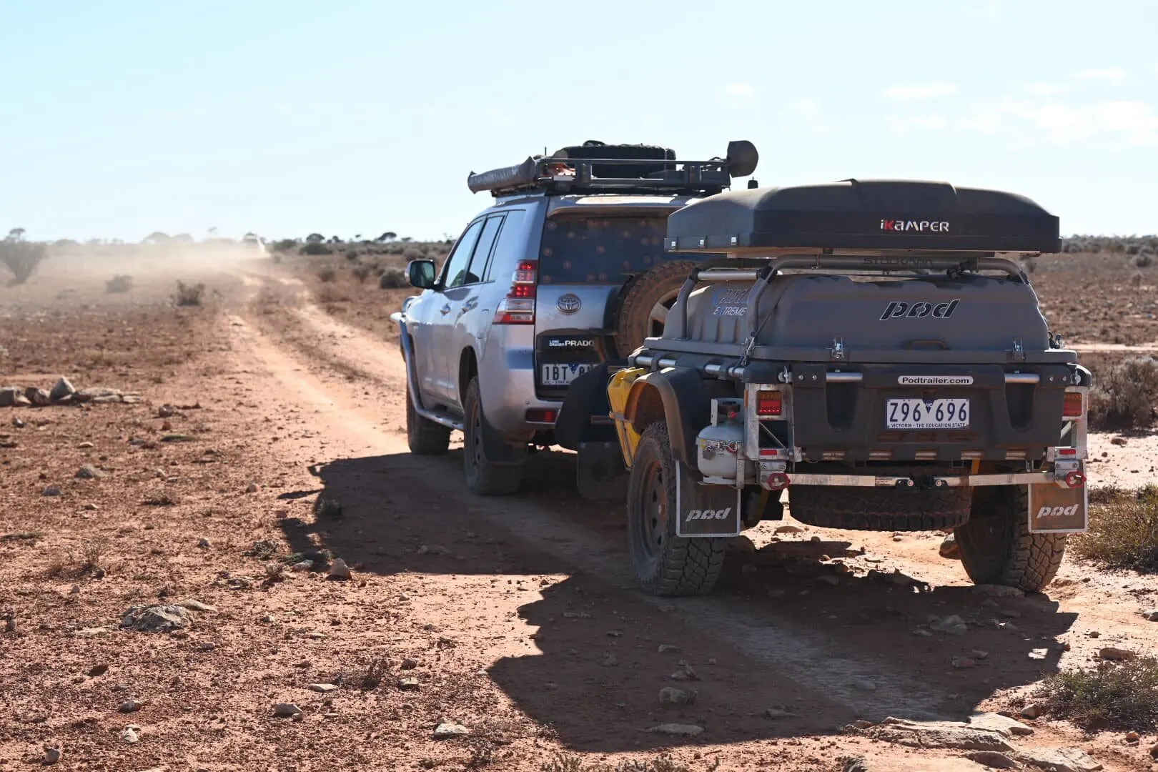 A Stockman Pod Trailer parked at the back of a 4WD