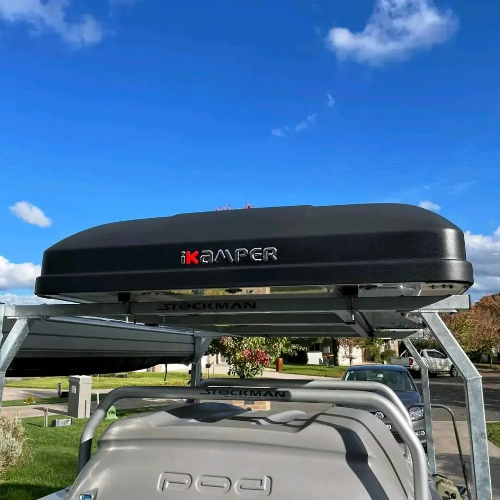 Pod Trailer fitted with roof racks, a kayak and a roof-top tent