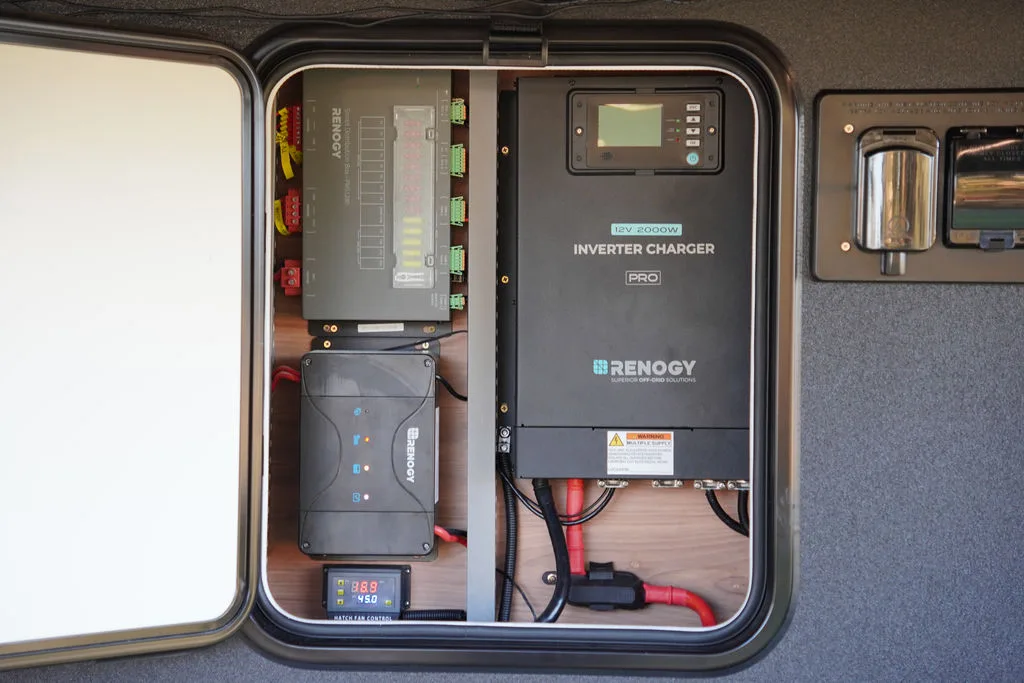 Renogy inverter charger and power management components in the Rover Ultra power cupboard